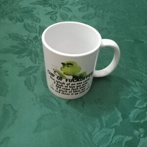 Novelty Grinch Christmas mug with coarse language and gesture
